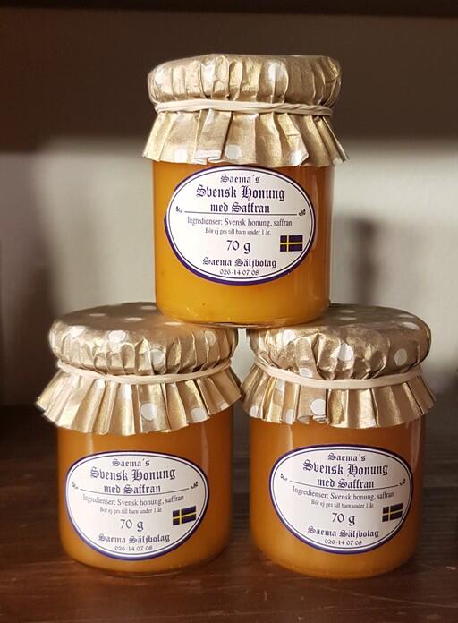 Honung med smak av Saffran i trevlig honungsburk med hätta.